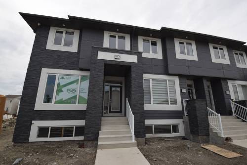 Todd Lewys / Free Press
                                The intelligently designed Aqua Townhomes have sold out phase one (with the exception of the show home); phase two is 50 per cent complete, with its 18 units being ready for possession sometime in November.