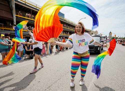 JOHN WOODS / FREE PRESS 
                                A participant walks in the June 7 Pride Parade in downtown Winnipeg.