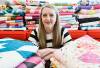 JOHN WOODS / FREE PRESS
                                Holly Clarke shows off some of her quilts in her living room, Tuesday.
