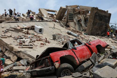 THE ASSOCIATED PRESS
                                A vehicle is shown crushed at a building that collapsed June 26 after earthquakes struck La Guaira, Venezuela on June 25.