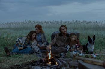 Eric Zachanowich / Netflix
                                The new Little House on the Prairie features (from left) Skywalker Hughes as Mary Ingalls, Crosby Fitzgerald as Caroline Ingalls, Luke Bracey as Charles Ingalls, and Alice Halsey as Laura Ingalls.