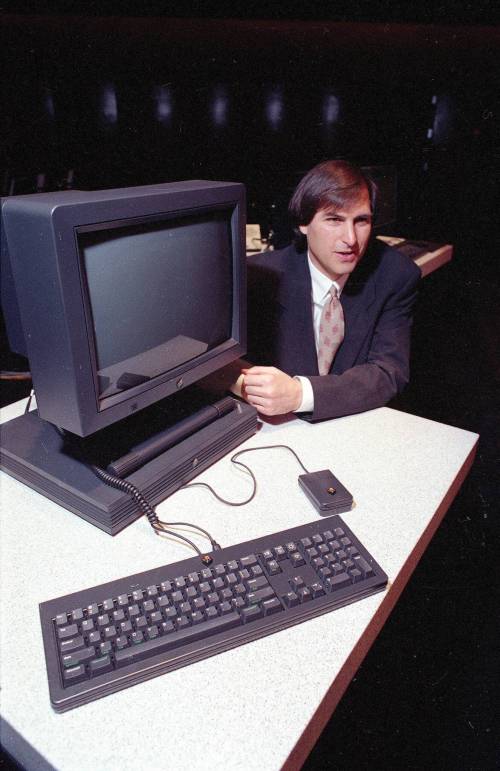 Eric Risberg / Associated Press files
                                In this 1990 photo Steve Jobs, then president and CEO of NeXT Computer Inc., shows off the new NeXTstation computer in San Francisco.