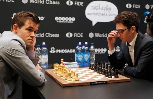 Frank Augstein / Associated Press files
                                Norwegian Magnus Carlsen (left) and Italian-American Fabiano Caruana wait for the start of the final day of the World Chess Championship in London in 2018.