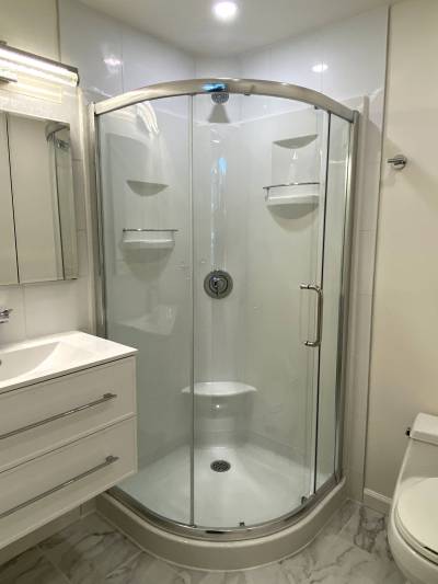 Marc LaBossiere photos / Free Press
                                The prefab fibreglass shower stall required a custom tiled back wall to get the shower head at the proper height.