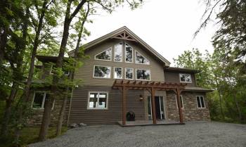 The 3,200 sq. ft. cottage offers an amazing lakefront location, and was designed with flair.