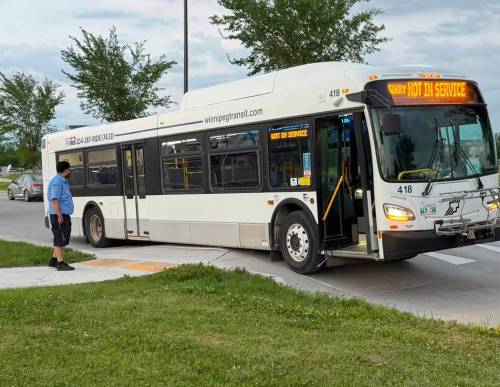 SUPPLIED tran
                                A transit bus got stuck on a buckled road along Bridge Lake Drive on Monday.