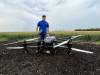 AARON EPP / FREE PRESS 
                                Kevin Falk, a research scientist at Corteva Agriscience Canada Co., with a DJI Agras T50 drone at Innovation Farms in Grosse Isle on Wednesday.