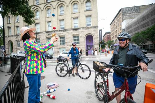 MIKAELA MACKENZIE / FREE PRESS
                                Tait Palsson, a.k.a. T8 the Gr8, juggles for passers-by at the Fringe Festival kickoff at Old Market Square earlier this week.