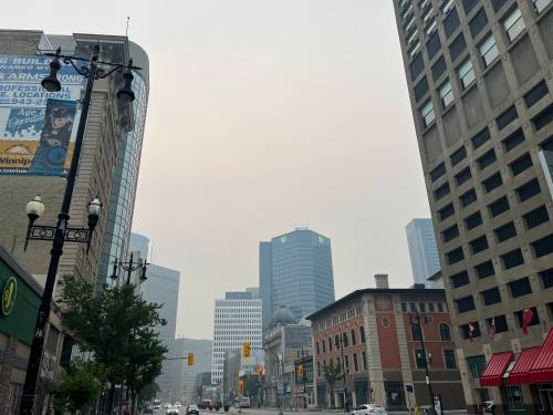 Russell Wangersky / Free Press File
                                Forest fire smoke clouds the skies over downtown Winnipeg in July, 2025.