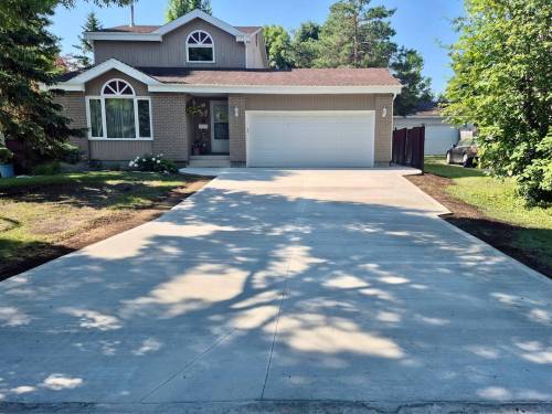 Photos by Marc LaBossiere / Free Press
                                This new driveway and approach conform to building codes, while meeting the desired layout requirements of the homeowners.