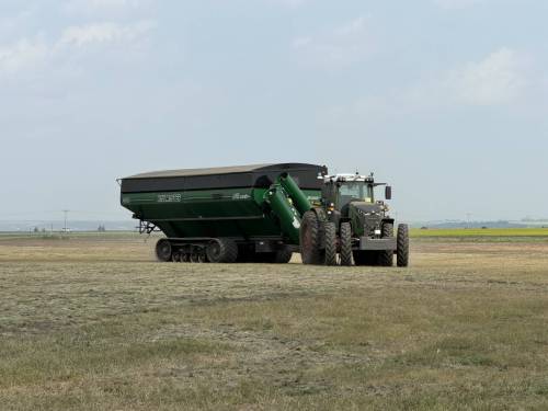 Laura Rance-Unger 
                                This tractor and grain cart have no driver. The unit is operated remotely and is called to the combine when it is time to unload the hopper.