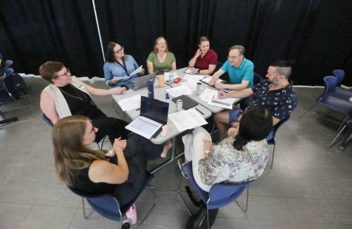 Matt Goerzen/The Brandon Sun
                                Participants chat at one of several tables set up at Brandon University for a public listening session organized by the province to gather perspectives on the governance and responsible use of artificial intelligences, cybersecurity and the protection of Manitobans&rsquo; data.