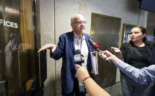 RUTH BONNEVILLE / FREE PRESS
                                Councillor Russ Wyatt tries to evade reporters as he walks into City Hall 1 hour late Thursday. See story Aug 13th,, 2026