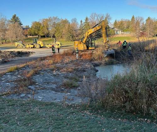 Free Press Files
                                City workers attempt to fix a sinkhole near the Sturgeon Creek active transportation route in October, 2024. A new sinkhole has opened nearby.