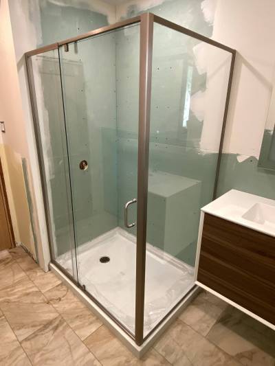 Marc LaBossiere / Free Press
                                By pre-mounting the shower enclosure, the profile tile had a flat edge against which it could be mounted.