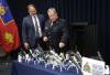 RUTH BONNEVILLE / FREE PRESS
                                At a news conference Tuesday, RCMP Supt. Jeff Asmundson and Manitoba Justice Minister Matt Wiebe look over the large amount of guns and drugs confiscated during a nearly tw0-year investigation.