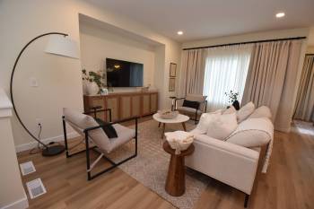 Simple yet elegant, the great room is an inviting space that&rsquo;s ideal for family movie nights or visiting with guests after dinner.