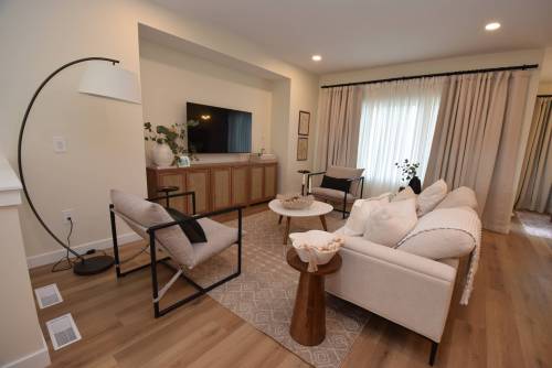 Simple yet elegant, the great room is an inviting space that&rsquo;s ideal for family movie nights or visiting with guests after dinner.