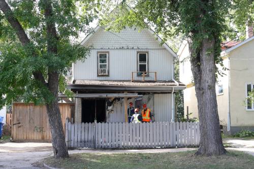 MIKE DEAL / FREE PRESS
                                The fire injured three people, one of whom is in critical condition.