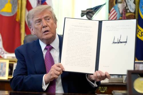 The Associated Press
                                U.S. President Donald Trump holds up an executive order renaming Lake Ontario as &lsquo;Lake America.&rsquo;
