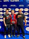 Supplied
                                From left: Wrestlers Madi Parks, Kaura Coles and Canadian national program coach David Spinney at the U20 worlds in Slovakia in August. Coles became just the fifth Canadian to win a U20 world title on Aug. 19, 2026.