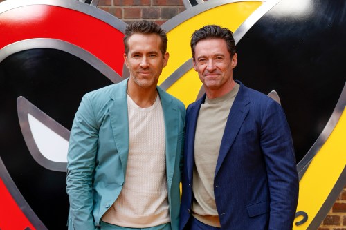 FILE - Ryan Reynolds, left, and Hugh Jackman pose for photographers upon arrival at the screening of the film 
