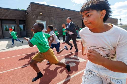 MIKE DEAL / FREE PRESS
                                Premier Wab Kinew runs a race with kids from BGC Winnipeg after the Aug. 27 announcement of a new health and physical education curriculum