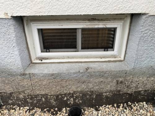 Marc LaBossiere photos / Free Press
                                The old window met egress width requirements, but needed more depth, which meant enlarging the rough opening by cutting out the lower portion of concrete footing.