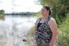 Jayclyn Morrissette on the banks of the Red River where she rescued a two-year-old girl and her dad from drowning last week. (Ruth Bonneville / Free Press)