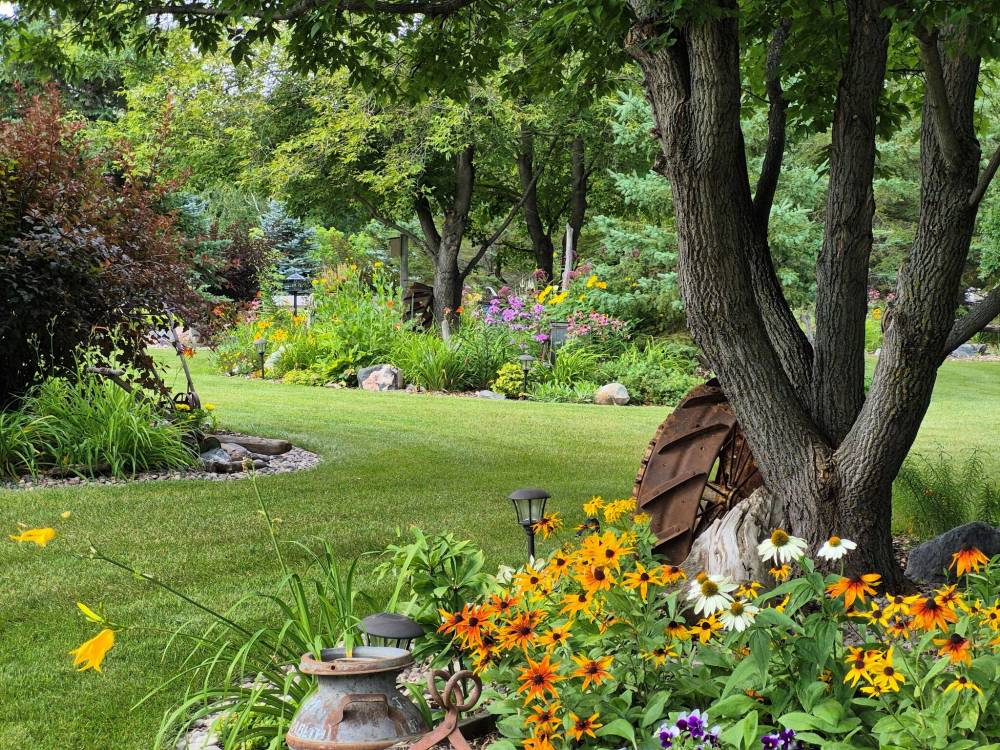 Colleen Zacharias photos
                                In Karl and Mary Loepp&rsquo;s garden, beautiful vistas are around every curve.