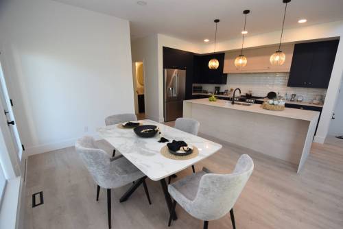 Todd Lewys photos / Free Press
                                The kitchen and dining area at 111 Bullrush Bay has ample space for entertaining family and friends.