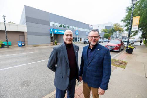MIKE DEAL / FREE PRESS
                                Alain Laberge (left) supperintendent of the franco-manitobaine school division, and Luc Bremault, assistant superintendent, outside 170 Marion St., where design work is beginning on a new French-language culinary arts facility.