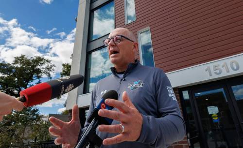 MIKE DEAL / FREE PRESS
                                Incumbent mayor, Scott Gillingham, scrums with media Tuesday afternoon, outside 1510 Main Street, a brand new 72-unit residential building developed by Inuka. Inuka is a Black-led, community-rooted nonprofit creating sustainable, affordable housing for low- to moderate-income households in Winnipeg.