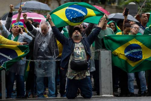 Supporters of President Jair Bolsonaro protest against his defeat in the presidential runoff election, in Rio de Janeiro, Brazil, Wednesday, Nov. 2, 2022. Thousands of supporters called on the military Wednesday to keep the far-right leader in power, even as his administration signaled a willingness to hand over the reins to his rival Luiz Inacio Lula da Silva. (AP Photo/Bruna Prado)