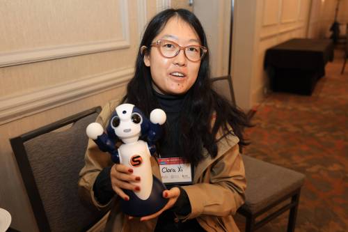 Mike Latschislaw photo
                                PhD student Clara Xie, a visiting researcher at the University of Manitoba, shows off a robot companion.
