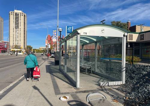 Ruth Bonneville / Free Press
                                Two people are in hospital and another two are in police custody after an assault at this Osborne Village bus stop on Osborne Street near River Avenue.