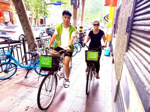 Victor Hamm, our guide, and Kerry MacNaull on the home stretch of our 20-kilometre cycle through Shanghai.