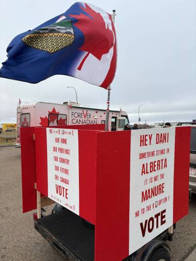 A trailer made by a Wainwright, Alta., resident addresses Premier Danielle Smith: &ldquo;Hey Dani, something stinks in Alberta; it is not the manure.&rdquo; (Melissa Martin / Free Press)