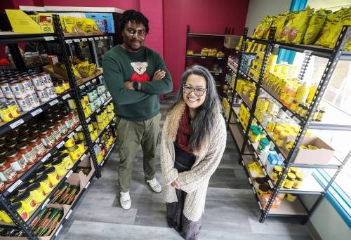 JOHN WOODS / FREE PRESS
                                Leilani Esteban-Villarba, executive director at Chalmers Neighbourhood Renewal Corp., and Michael Onwuka, store manager, at CHARM Hub, a low-cost grocery store on Ottawa Avenue.