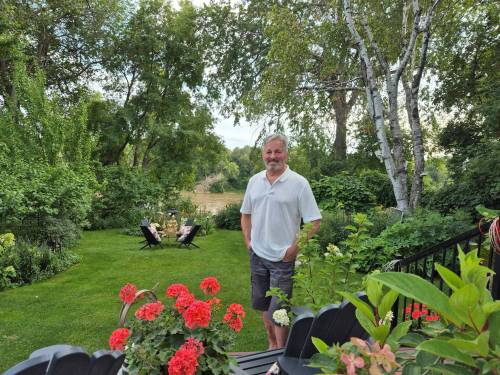 Colleen Zacharias photo
                                Tim Evans in his St. James garden, which sits along the Assiniboine River.