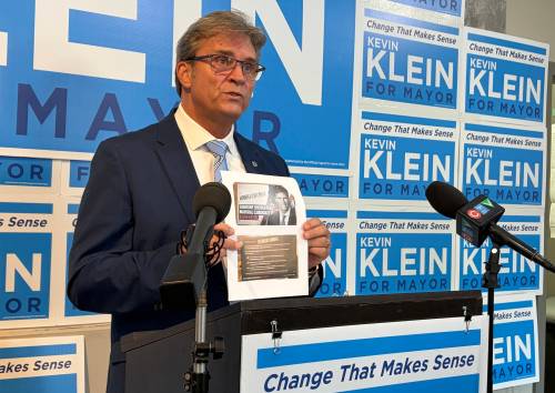 (Matthew Frank / Free Press) Mayoral candidate Kevin Klein holds attack ads by the Canadian Union of Public Employees Local 500 during a press conference Tuesday.