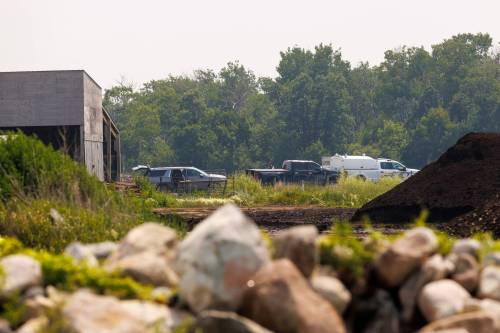 Investigators at the scene where two planes from Harv&rsquo;s Air flight school crashed south of Steinbach in July 2025. (Mike Deal / Free Press files)
