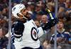 (Jeffer Roberson / The Canadian Press files / The Associated Press files)
                                Byfuglien celebrates after scoring in a Jets playoffs game against the St. Louis Blues, in 2019.