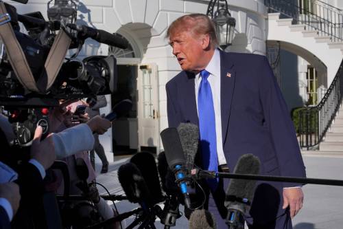 Scott Applewhite / The Associated Press
                                U.S. President Donald Trump speaks to reporters before boarding Marine One on the South Lawn of the White House in Washington, D.C.