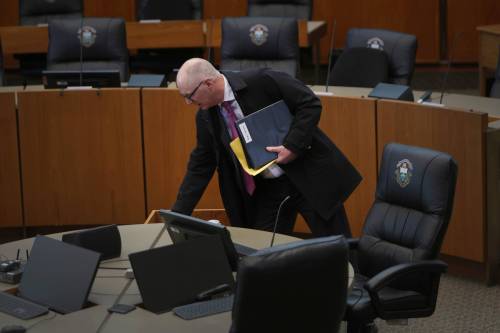 Mayor Scott Gillingham steps into the city hall council chamber before heading to his office Thursday morning after winning his second term. (Ruth Bonneville / Free Press)