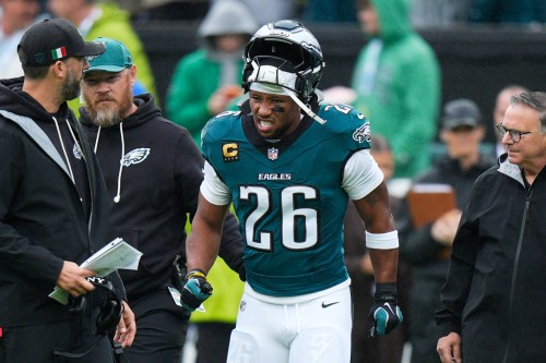 Philadelphia Eagles running back Saquon Barkley reacts as he walks off the field after an injury during the first half of an NFL football game against the Los Angeles Rams in Philadelphia, Sunday, Oct. 4, 2026. (AP Photo/Chris Szagola)