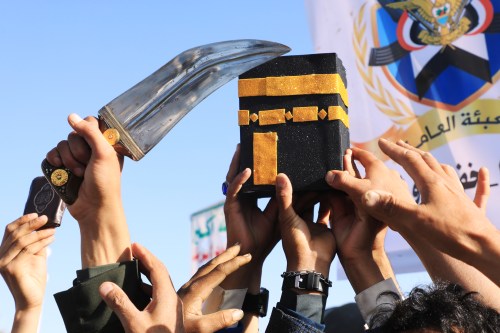 Supporters of Yemen's Houthi rebels raise a mock of the Kaaba, Islam's holiest site, during a rally in support of the group and to protest Saudi Arabia's accusation that the Houthis targeted Islam's holiest site of Mecca, in Sanaa, Yemen, Friday, Oct. 9, 2026. (AP Photo/Osamah Abdulrahman)