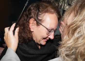 Kimberly Polman smiles as she's greeted by family members after being released from custody at provincial court, in Chilliwack, B.C., on Thursday, Oct. 27, 2022. The British Columbia woman was repatriated to Canada from a detention camp in Syria after marrying an ISIS fighter. THE CANADIAN PRESS/Darryl Dyck