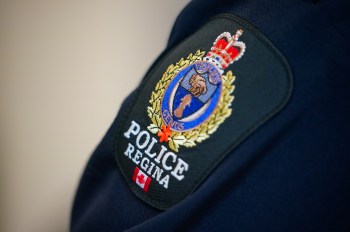 A Regina Police badge can be seen on an officer’s uniform on Tuesday, October 28, 2025. THE CANADIAN PRESS/Heywood Yu
